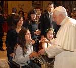 Pope Benedict XVI greets people in wheelchairs in St Peter's