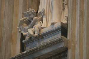 Angel holding Scroll at the base of the St Joan Antida Thouret statue
